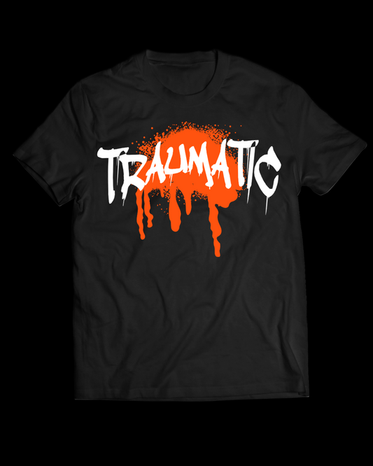 Black t-shirt with 'TRAUMATIC' in white and orange on a black background